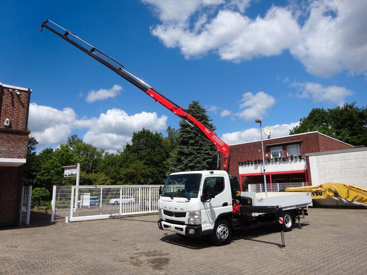 FUSO Canter 7C15 mit FASSI F65A Kran - Crane truck, Dropside/ Flatbed truck: picture 1 FUSO Canter 7C15 mit FASSI F65A Kran - Crane truck, Dropside/ Flatbed truck: picture 1