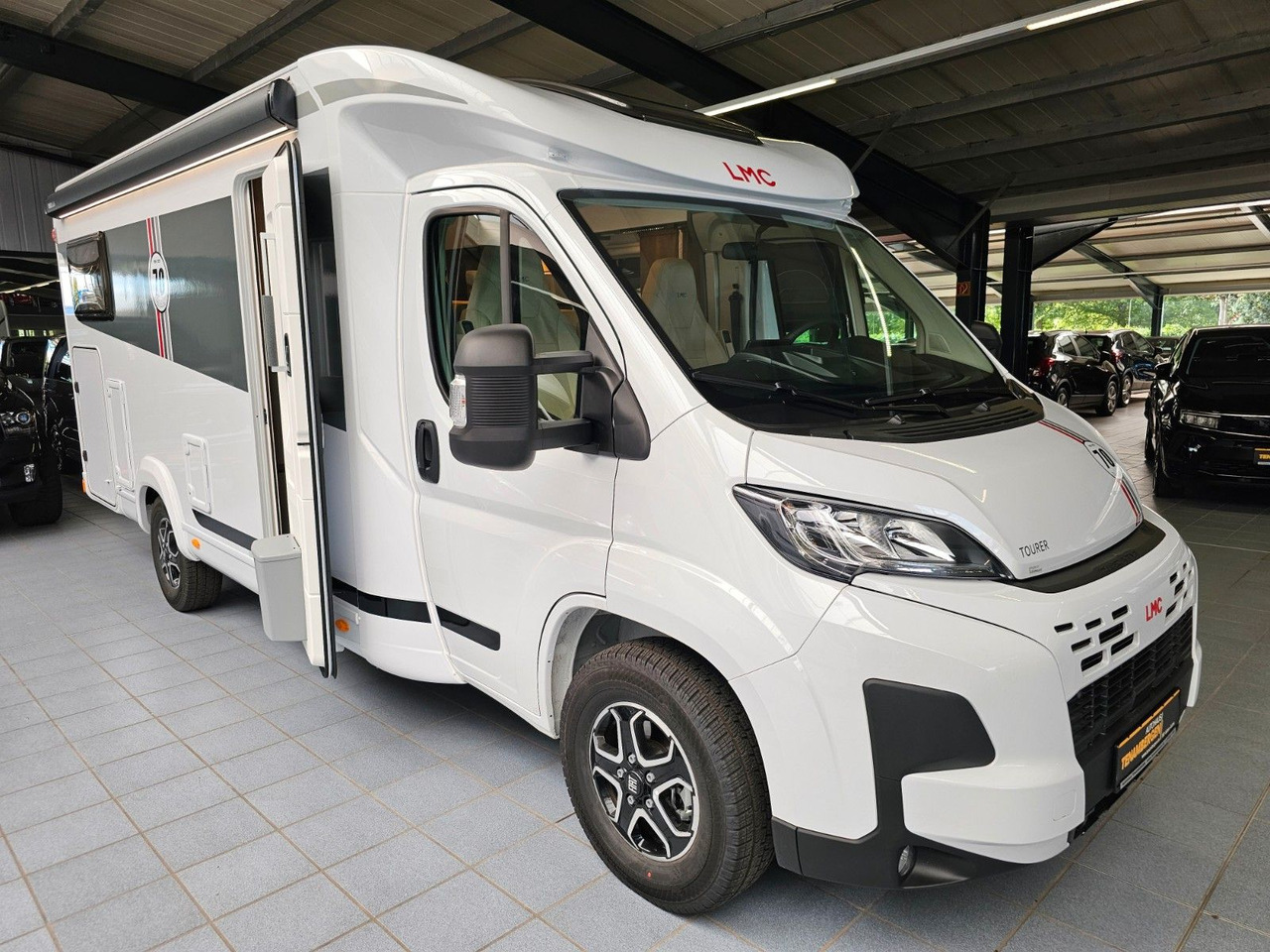 LMC Tourer T660G 70 Jahre AT-8 WC Markise Navi - Semi-integrated motorhome: picture 1 LMC Tourer T660G 70 Jahre AT-8 WC Markise Navi - Semi-integrated motorhome: picture 1