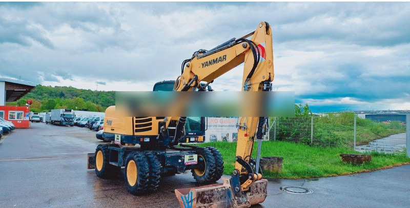 Yanmar B 95W Mit Drei Löffeln und Ein Hammer - Wheel excavator: picture 1 Yanmar B 95W Mit Drei Löffeln und Ein Hammer - Wheel excavator: picture 1